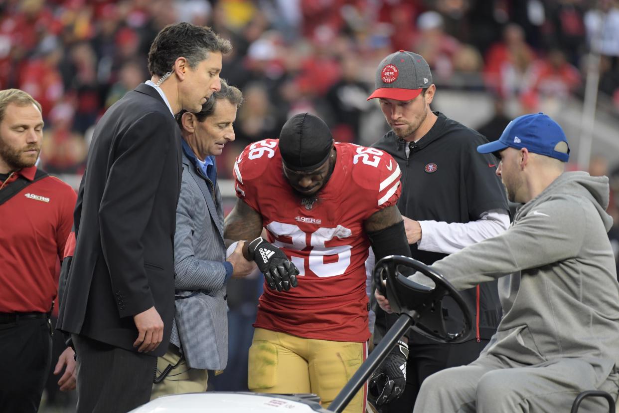 Tevin Coleman left Sunday's game on a cart. (Kirby Lee/Reuters)