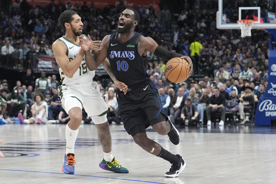 Dallas Mavericks forward Tim Hardaway Jr. (10) dribbles against Milwaukee Bucks guard Cameron Payne (15) during the second half of an NBA basketball game in Dallas, Saturday, Feb. 3, 2024. (AP Photo/LM Otero)