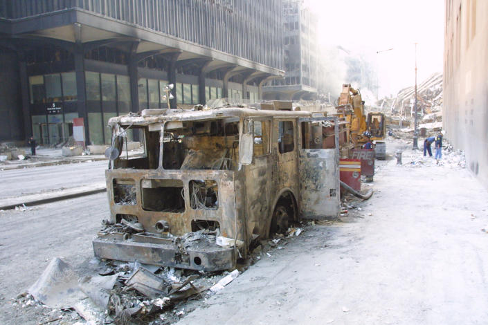 <p>A destroyed fire truck on September 14, 2001, near Ground Zero. (Photo: Stuart Ramson/AP) </p>