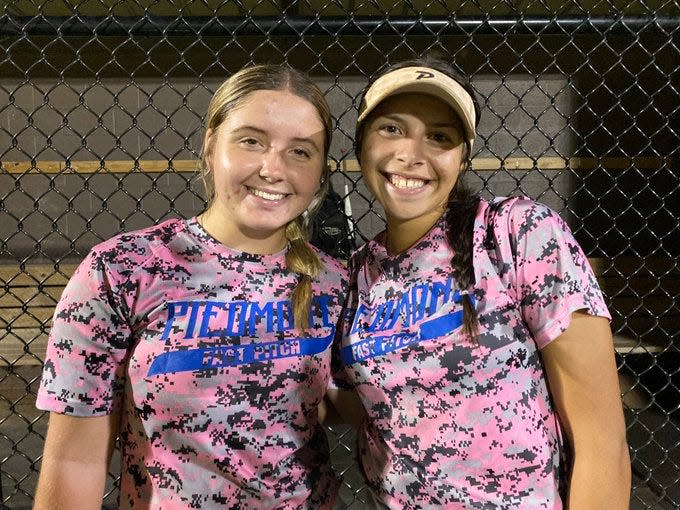 Piedmont sophomore third baseman Ashlyn Emmert (left) and junior shortstop Addison Cassady (right) were all smiles after a 20-4 win at Yukon on Aug. 29, 2023.