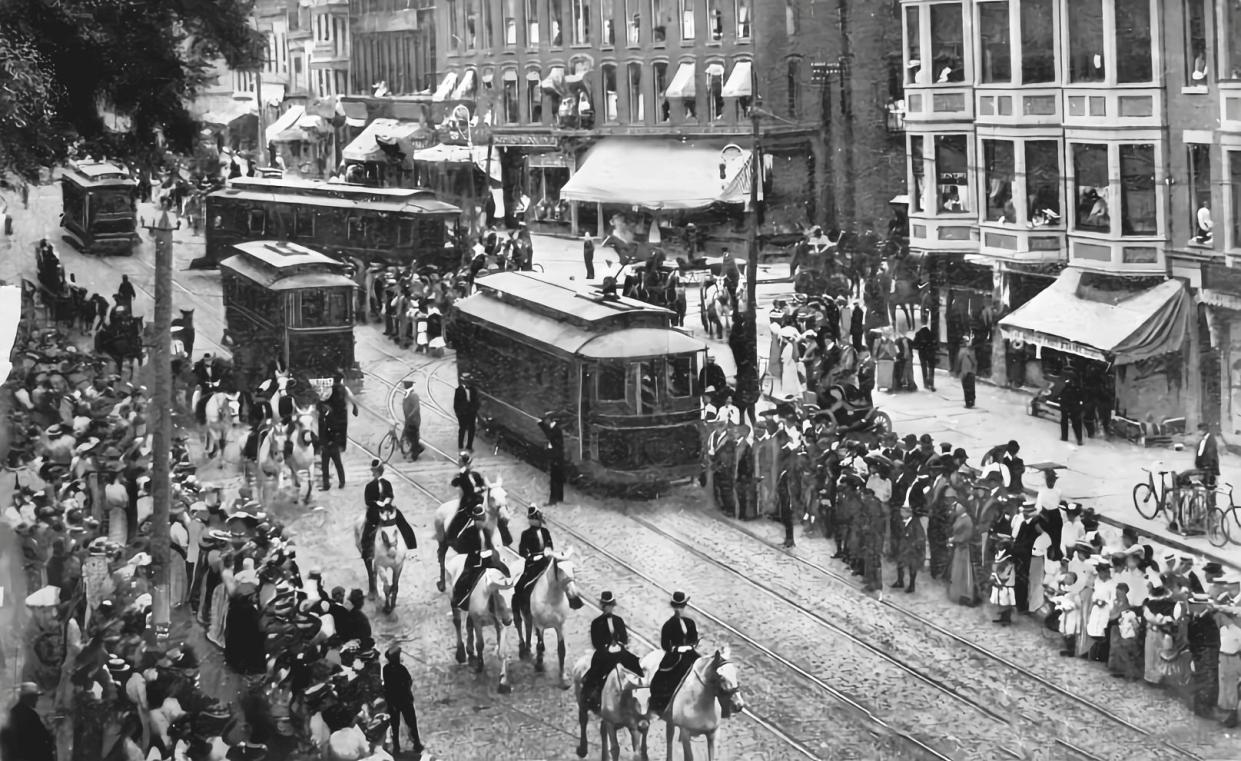 Everyone loves a parade, especially a circus parade, and so did Uticans in the late 19th century. This photo was taken on Genesee Street, between Bleecker and Columbia streets. You are looking south toward Columbia (center right) and the parade is marching north. All trolleys stopped in their tracks to make room for thousands of spectators and riders on horseback. They were followed by the circus band, jugglers and elephants. In the 1890s, the Ringling Brothers—Albert, Alfred, Charles, John, August, Henry and Otto—set up their tents on Whitesboro Street, just west of Baggs Square.