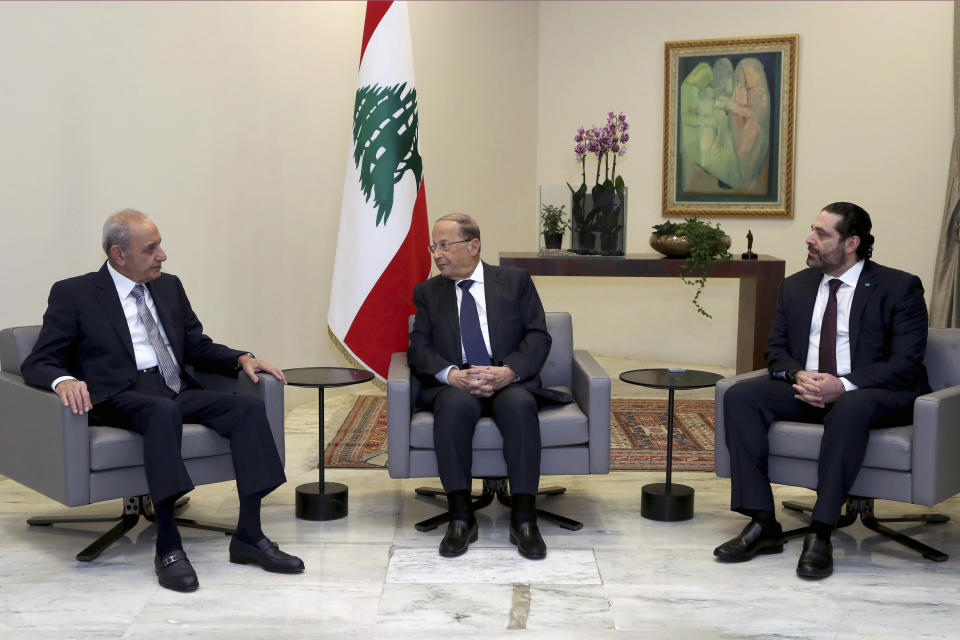 In this photo released by Lebanon's official government photographer Dalati Nohra, Lebanese President Michel Aoun, center, meets with Lebanese newly-assigned Prime Minister, Saad Hariri, right, and Parliament Speaker Nabih Berri, left, meets at the presidential palace, in Baabda, east of Beirut, Lebanon, Thursday, Jan. 31, 2019. Lebanese political factions have agreed on the formation of a new government, breaking a nine-month deadlock that only deepened the country' economic woes. (Dalati Nohra via AP)