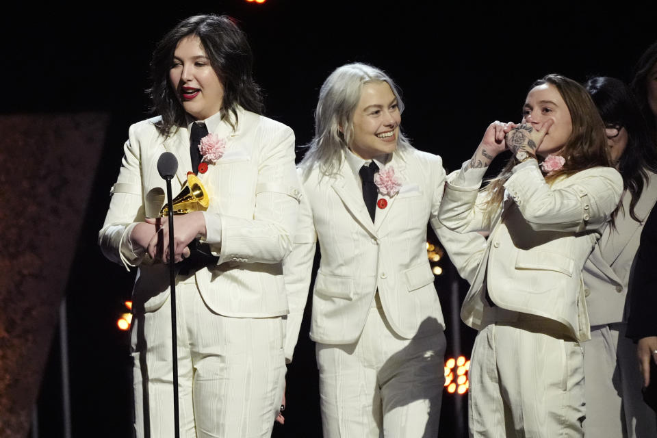 Lucy Dacus, from left, Phoebe Bridgers, Julien Baker, of boygenius accept the award for best rock performance "Not Strong Enough" during the 66th annual Grammy Awards on Sunday, Feb. 4, 2024, in Los Angeles. (AP Photo/Chris Pizzello)