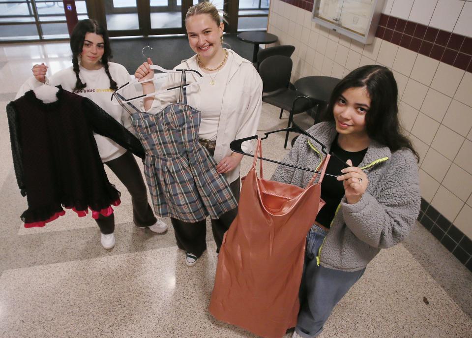 Iowa State University senior student clothing designers (from left) Dorothy Vernon, Ellie Hauler, and Nayeli Acosta show their designed garments for the university's upcoming fashion show at Lebraon Hall Wednesday, April 5, 2023, in Ames, Iowa.