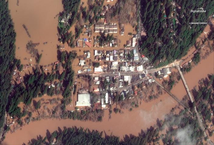 This Thursday, Feb. 28, 2019 satellite image provided by DigitalGlobe&nbsp;shows The Russian River flooding Guerneville, Calif.