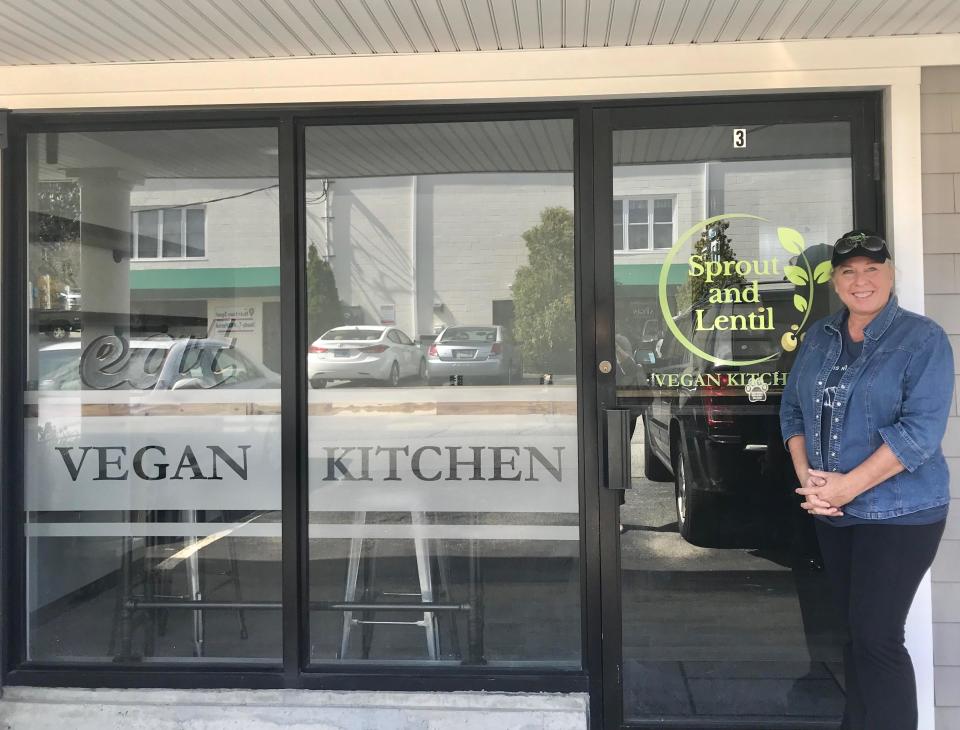 Carmen Foy stands in front of the Sprout and Lentil storefront on Aquidneck Avenue in Middletown.