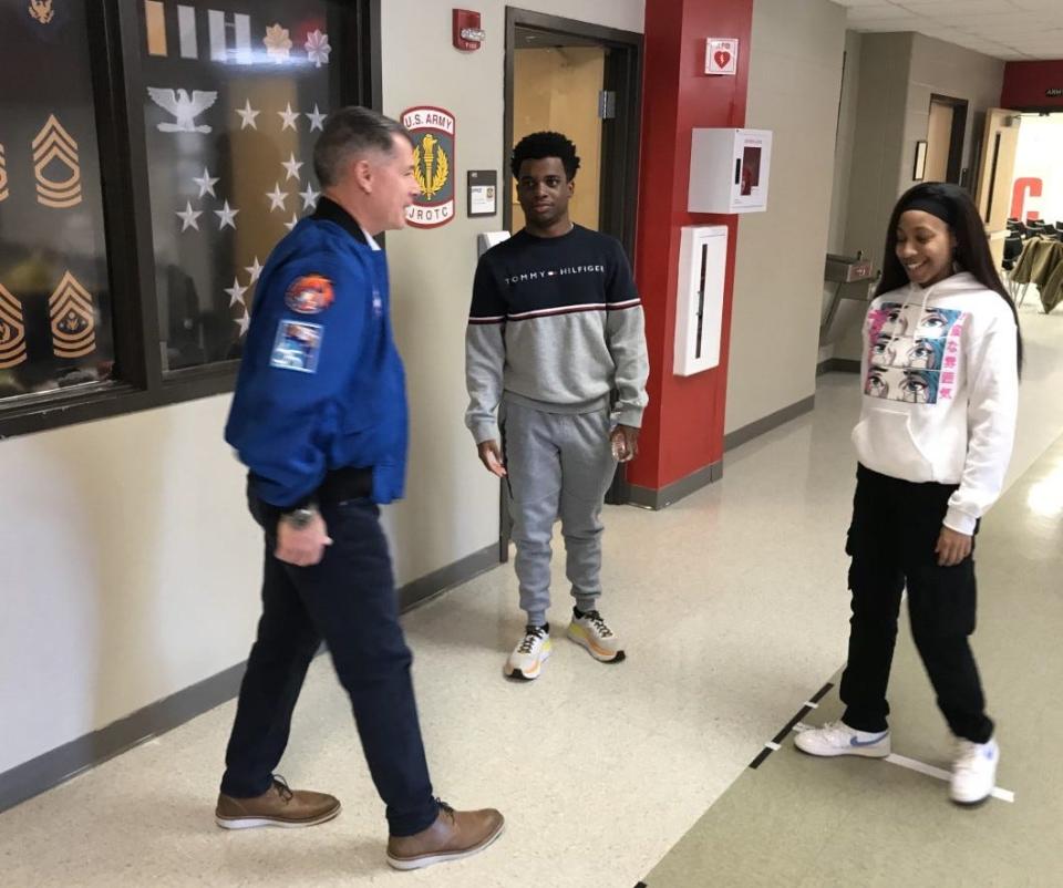 NASA astronaut Shane Kimbrough greets former Clarke Central JROTC members Caleb Miller and Karamyah Harris on Friday, Nov. 18, 2022.