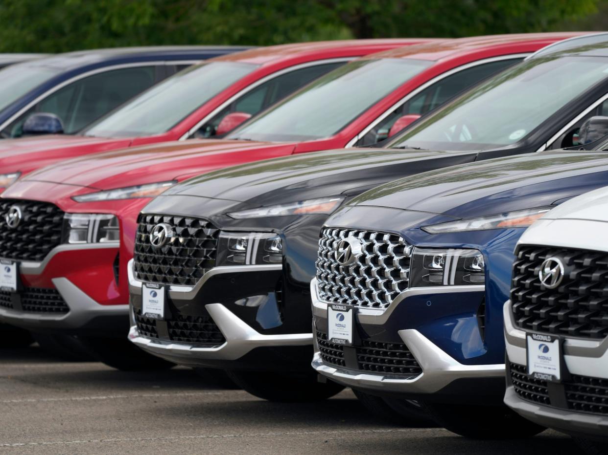 Hyundai SUVs at a car dealership.