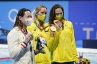 From left, Siobhan Bernadette Haughey, of Hong Kong, Emma Mckeon, of Australia and Cate Campbell, of Australia pose with their medals after the women's 100-meter freestyle final at the 2020 Summer Olympics, Friday, July 30, 2021, in Tokyo, Japan. (AP Photo/Jae C. Hong)