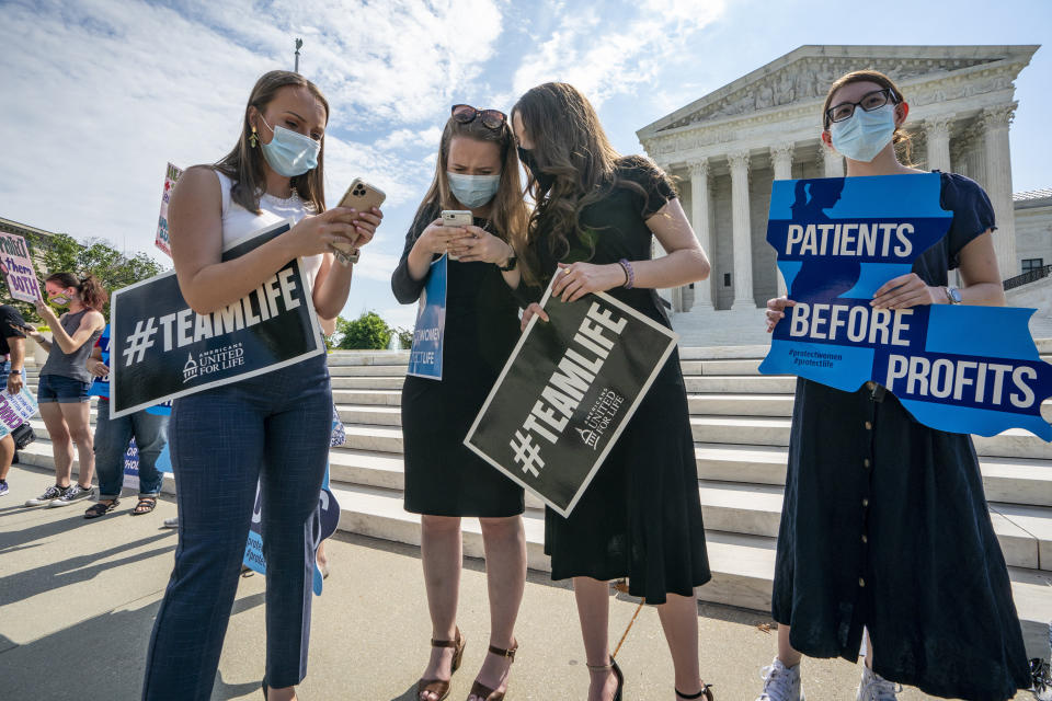 Anti-abortion activists wait in vain outside the Supreme Court for a decision Thursday. Roberts would join the court's more liberal justices in a 5-4 decision Monday striking down a Louisiana anti-abortion law. (Photo: J. Scott Applewhite/ASSOCIATED PRESS)