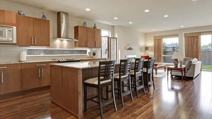 Bright modern open plan kitchen room interior.