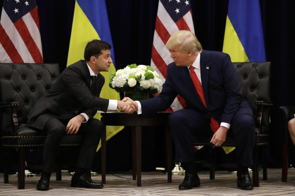 FILE - In this Wednesday, Sept. 25, 2019 file photo, President Donald Trump meets with Ukrainian President Volodymyr Zelenskiy at the InterContinental Barclay New York hotel during the United Nations General Assembly in New York. The House impeachment inquiry is zeroing in on two White House lawyers privy to a discussion about moving a memo recounting President Donald Trump’s phone call with the leader of Ukraine into a highly restricted computer system normally reserved for documents about covert action. (AP Photo/Evan Vucci, File)