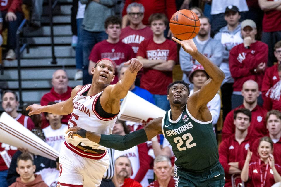 Indiana forward Malik Reneau and Michigan State center Mady Sissoko reach for the ball during the first half on Sunday, March 10, 2024, in Bloomington, Indiana.