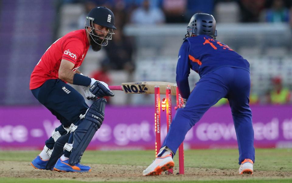 Moeen Ali of England is stumped by Dinesh Karthik of India during the First Vitality Blast IT20 between England and India at Ageas Bowl - Steve Bardens/Getty Images