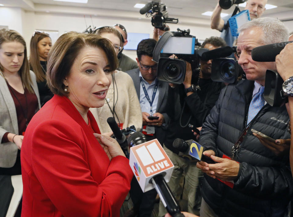 Democratic presidential candidate Sen. Amy Klobuchar, D-Minn, speaks with the media after participating in a Fair Fight phone bank at Ebenezer Baptist Church, Thursday, Nov. 21, 2019, in Atlanta. Democratic presidential candidates including Klobuchar, Cory Booker, Andrew Yang and Pete Buttigieg, along with Stacey Abrams, joined in at the phone bank in response to Georgia election officials' plan to cancel more than 313,000 voter registrations next month. (Bob Andres/Atlanta Journal-Constitution via AP)