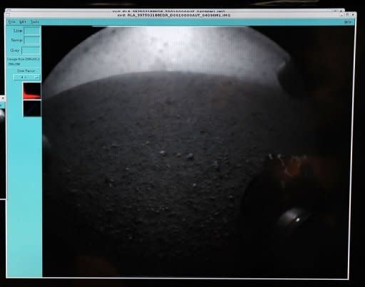 An image transmitted from the Curiosity Rover of the vehicle's wheel on Mars