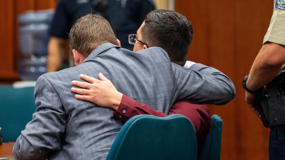 Raul Cuevas and his attorney, Alexander Briggs, hug after hearing his sentence for second-degree murder at the Ada County Courthouse in Boise. Cuevas was found guilty of killing Jesus Urrutia in March 2023, when he stabbed Urrutia in the chest after Urritia alledgedly stabbed to death Michelle Luna, Cuevas’ mother, in Nampa.