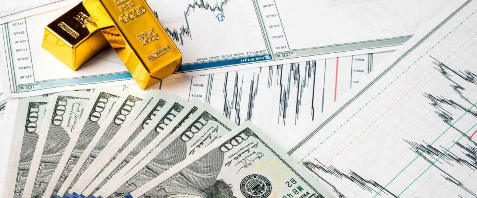 gold bars at dollar bills, rise and fall of gold exchange rate against dollar financial concept diagram showing changes in price of gold. Concept of inflation