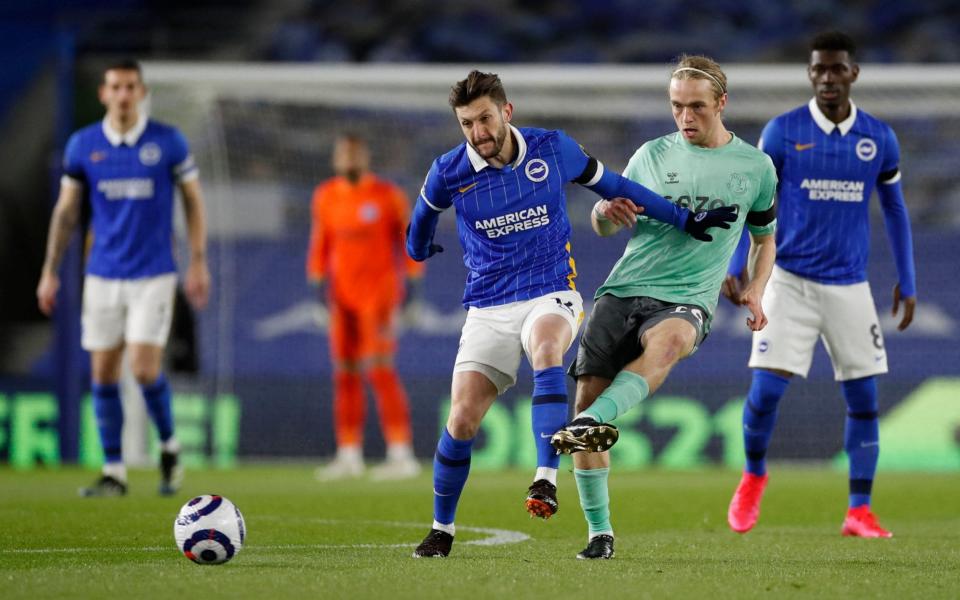 Adam Lallana (left) challenges Tom Davies - Brighton held by injury-hit Everton in dull goalless draw - GETTY IMAGES