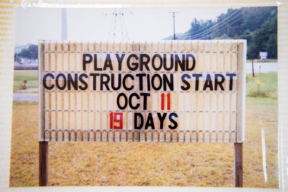 Photos of the preparation and construction of the Claxton Community Playground in 2000 are seen in a photo album kept at the Claxton Community Center on Wednesday, Jan. 18, 2023.