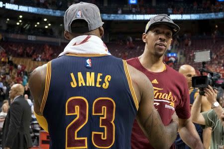 May 27, 2016; Toronto, Ontario, CAN; Cleveland Cavaliers forward LeBron James (23) celebrates the win with Cleveland Cavaliers forward Channing Frye (9) at the end of game six of the Eastern conference finals of the NBA Playoffs against the Toronto Raptors at Air Canada Centre. The Cleveland Cavaliers won 113-87. Mandatory Credit: Nick Turchiaro-USA TODAY Sports