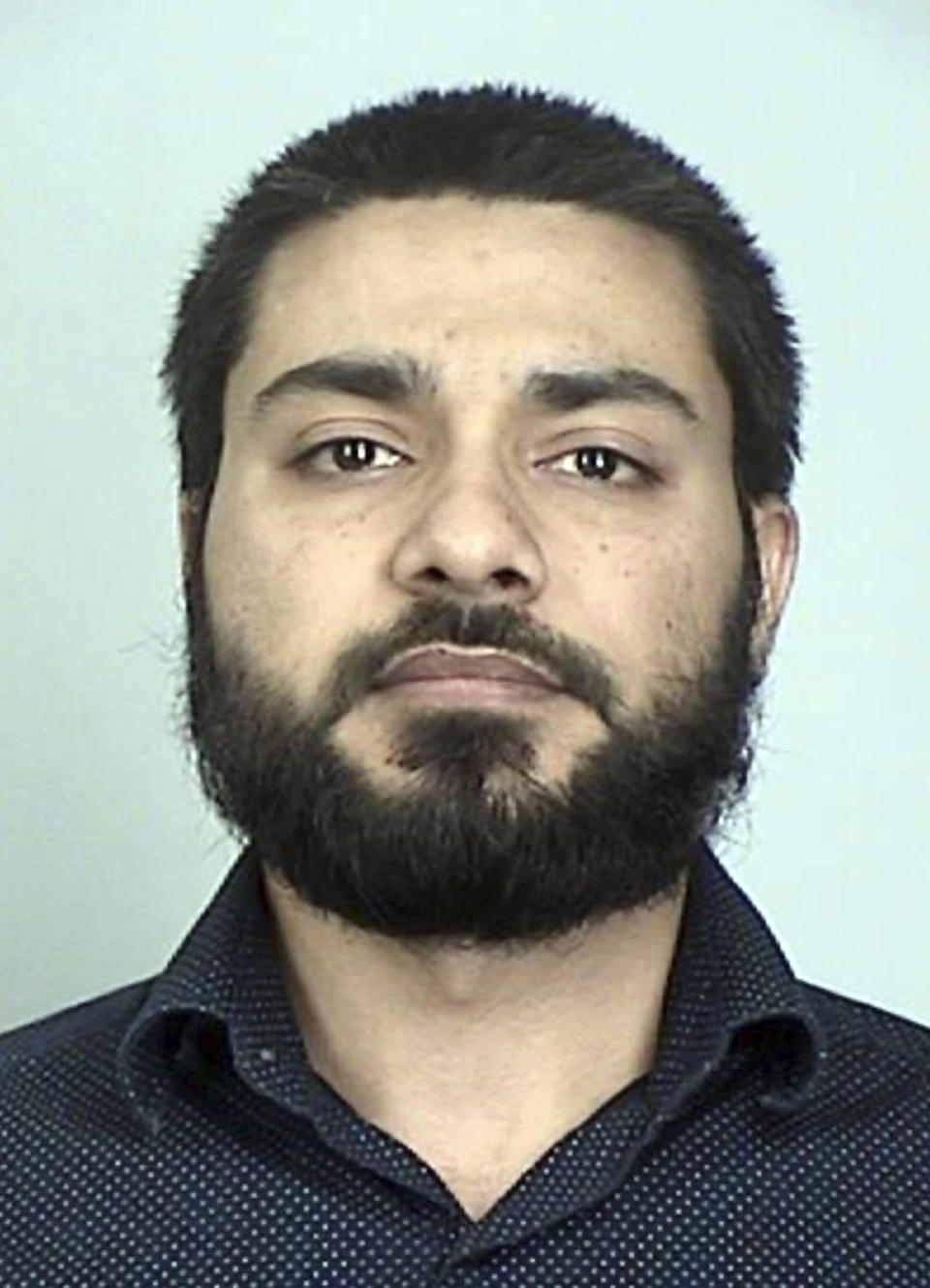 FILE - This booking photo provided by the Sherburne County, Minn., Sheriff's Office shows Muhammad Masood. Masood, the Pakistani doctor and former Mayo Clinic research coordinator who sought to join the Islamic State terrorist group to fight in Syria, was sentenced Friday, Aug. 25, 2023, to 18 years in prison. (Sherburne County Sheriff's Office via AP, File)