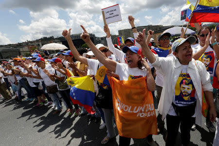 Opposition supporters shout slogans as they take part in a rally to demand a referendum to remove Venezuela's President Nicolas Maduro in Caracas, Venezuela October 22, 2016. REUTERS/Marco Bello