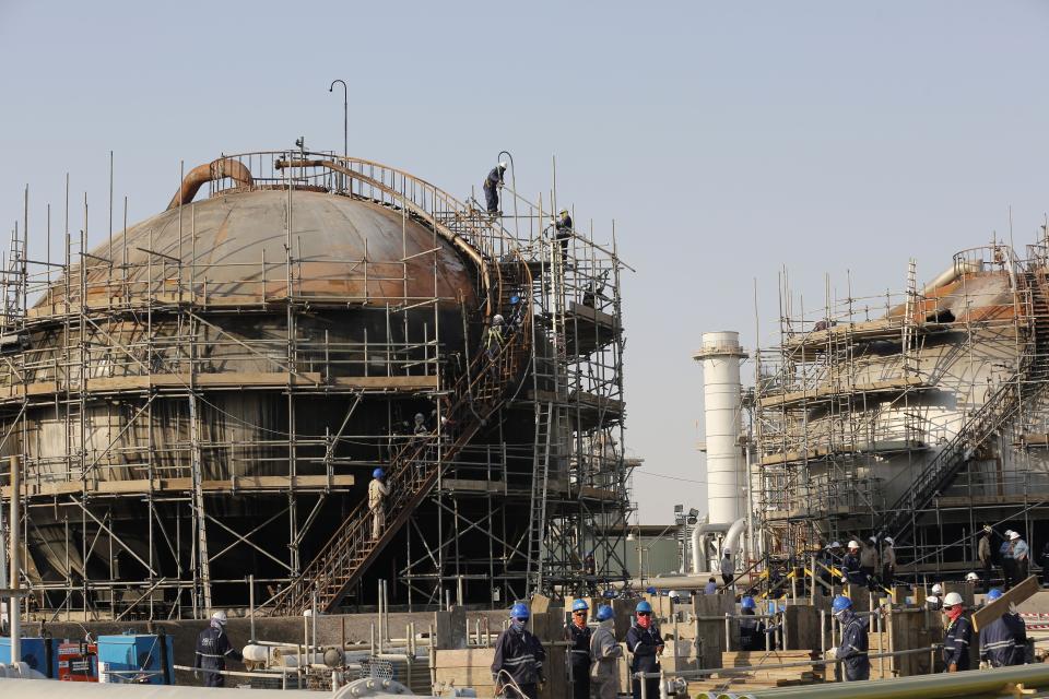 FILE- In this Sept. 20, 2019 file photo taken during a trip organized by Saudi information ministry, workers fix the damage in Aramco's oil separator at processing facility after the recent Sept. 14 attack in Abqaiq, near Dammam in the Kingdom's Eastern Province. Yemen’s war began in September 2014, when the Houthis seized the capital Sanaa. Saudi Arabia, along with the United Arab Emirates and other countries, entered the war alongside Yemen’s internationally recognized government in March 2015. The war has killed some 130,000 people and driven the Arab world’s poorest country to the brink of famine. (AP Photo/Amr Nabil, File)
