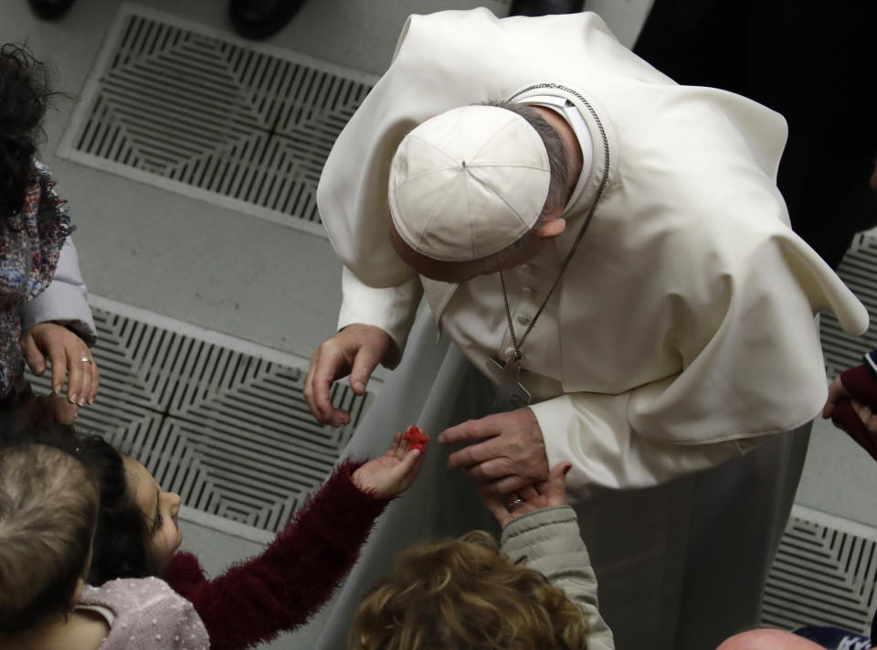 Pope Francis greets pilgrims at the end of his weekly general audience in the Paul VI Hall at the Vatican Wednesday, Feb. 20, 2019. (AP Photo/Alessandra Tarantino)