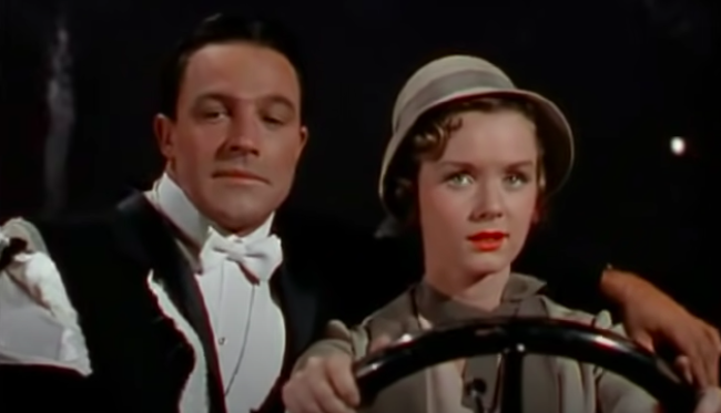 A man and a woman ride in a car together