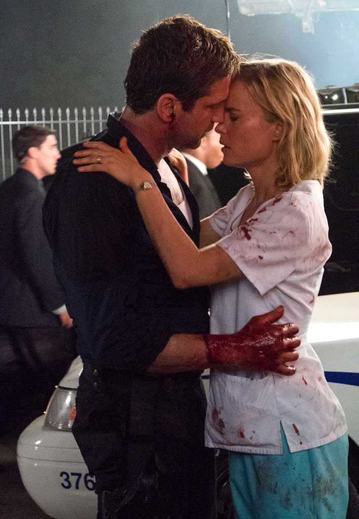 Gerard Butler and Radha Mitchell in FilmDistrict's "Olympus Has Fallen" - 2013