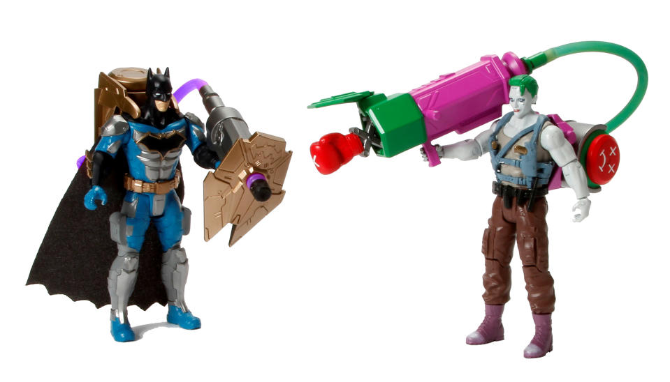 <p>Batman may not be a fan of firearms, but he’s not adverse to arming himself with projectile weapons. These 6-inch deluxe versions of the Caped Crusader and the Clown Prince of Crime come equipped with air-pump activated armaments that can be swapped between them. (Photo: Mattel/Warner Bros.) </p>