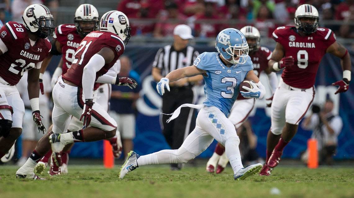 North Carolina’s Ryan Switzer (3) picks up yards in during South Carolina’s 17-13 victory in the Belk College Kickoff at Bank of American Stadium in Sept. 2015.