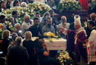 Archbishop of Genoa, Cardinal Angelo Bagnasco, blesses the coffin during the state funeral of the victims of the Morandi Bridge collapse, at the Genoa Trade Fair and Exhibition Centre in Genoa, Italy August 18, 2018. REUTERS/Stefano Rellandini