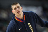 Denver Nuggets center Nikola Jokic warms up for the team's NBA basketball game against the Los Angeles Clippers on Tuesday, March 22, 2022, in Denver. (AP Photo/David Zalubowski)