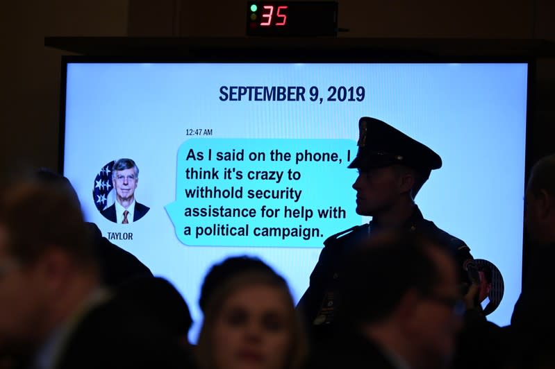 A text message is displayed at a House Intelligence Committee hearing on Capitol Hill in Washington