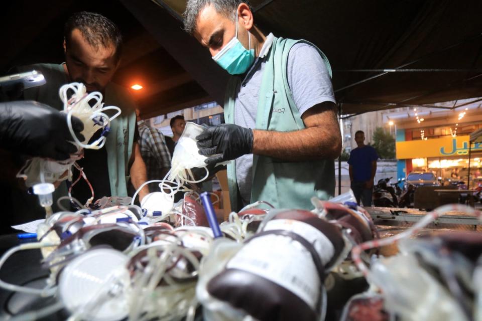 Medics collect blood donations in Beirut’s southern suburb after the explosions (AFP/Getty)