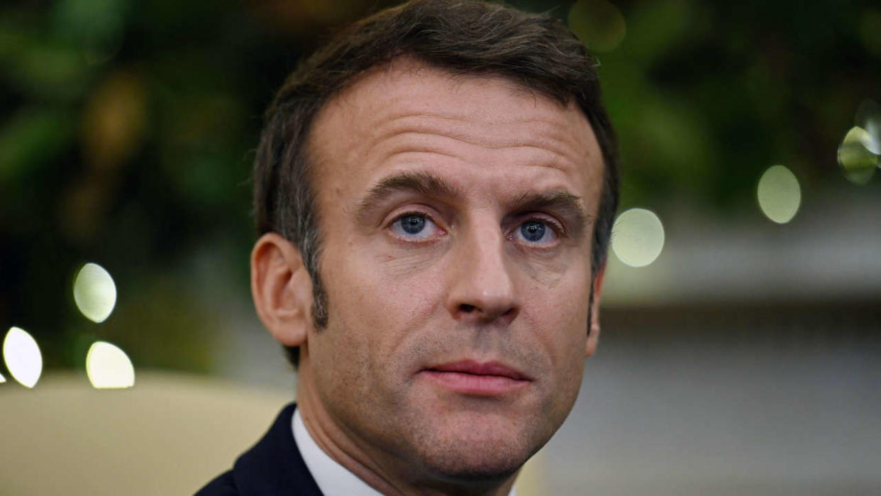 French President Emmanuel Macron speaks during a meeting with US President Joe Biden in the Oval Office of the White House in Washington, DC, on December 1, 2022. (Photo by Jim WATSON / AFP)