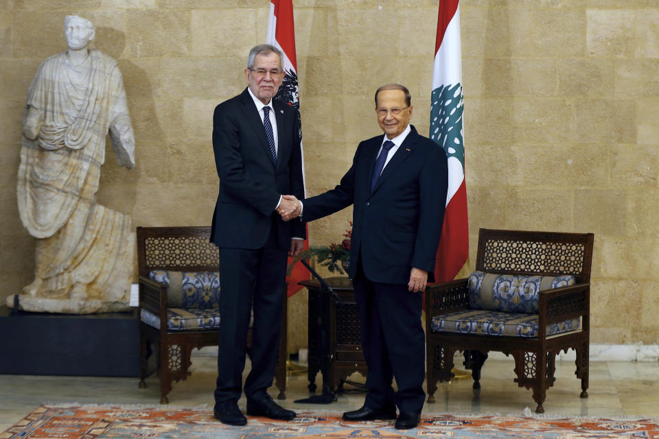 Lebanese President Michel Aoun, right, shakes hands with his Austrian counterpart Alexander Van Der Bellen, at the Presidential Palace in Baabda, east of Beirut, Lebanon, Tuesday, Dec. 11, 2018. (AP Photo/Bilal Hussein)