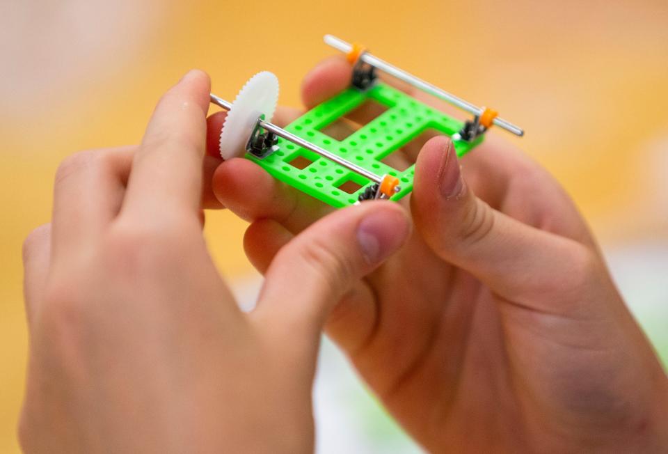 Carolyn Casas, 12, works on a solar-powered car during the GE Girls STEM Camp Wednesday, June 22, 2022, at Notre Dame.