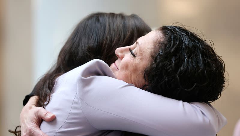 Shonie Christensen, domestic violence advocate and survivor, hugs Lindsey Boyer, South Valley Services executive director, after a press event for Domestic Violence Awareness Month at the Capitol in Salt Lake City on Monday, Oct. 2, 2023. Oct. 2 was declared Domestic Violence Awareness Day in Utah.