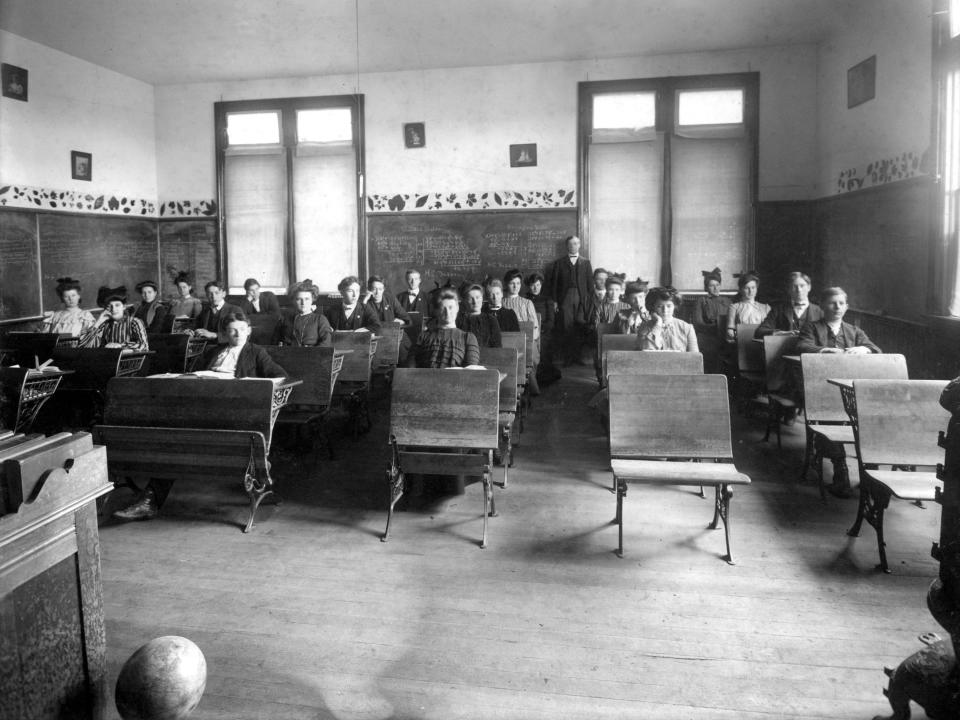 High school students in desks, mid-1900s