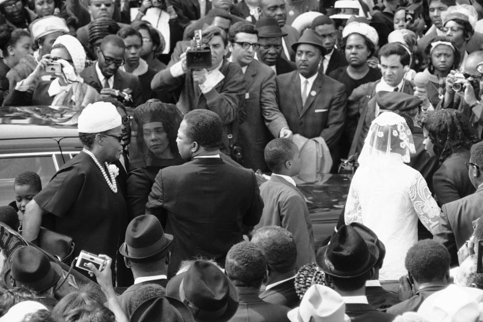 <p>Coretta Scott King arrives at Ebenezer Baptist Church for the funeral of her husband. To her right is the Rev. A. D. King, Dr. King’s brother. (Photo: AP) </p>