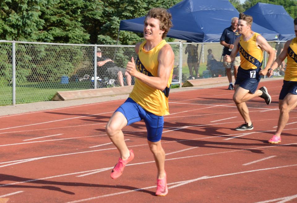 Landen Nastale of Erie Mason turns the final corner in the 200 meters at the Tri-County Conference track and field championships on Tuesday, May 21, 2024.