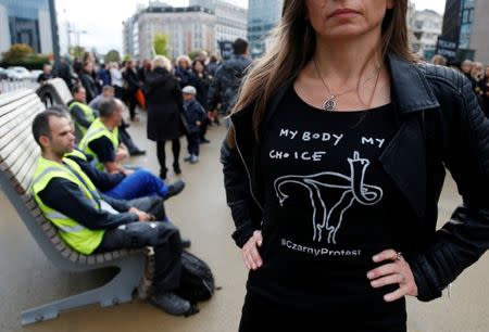 A demonstrator wears a shirt to protest against a proposed parliament bill to completely ban abortion in Poland, in front of European institutions in Brussels, Belgium, October 3, 2016. REUTERS/Francois Lenoir