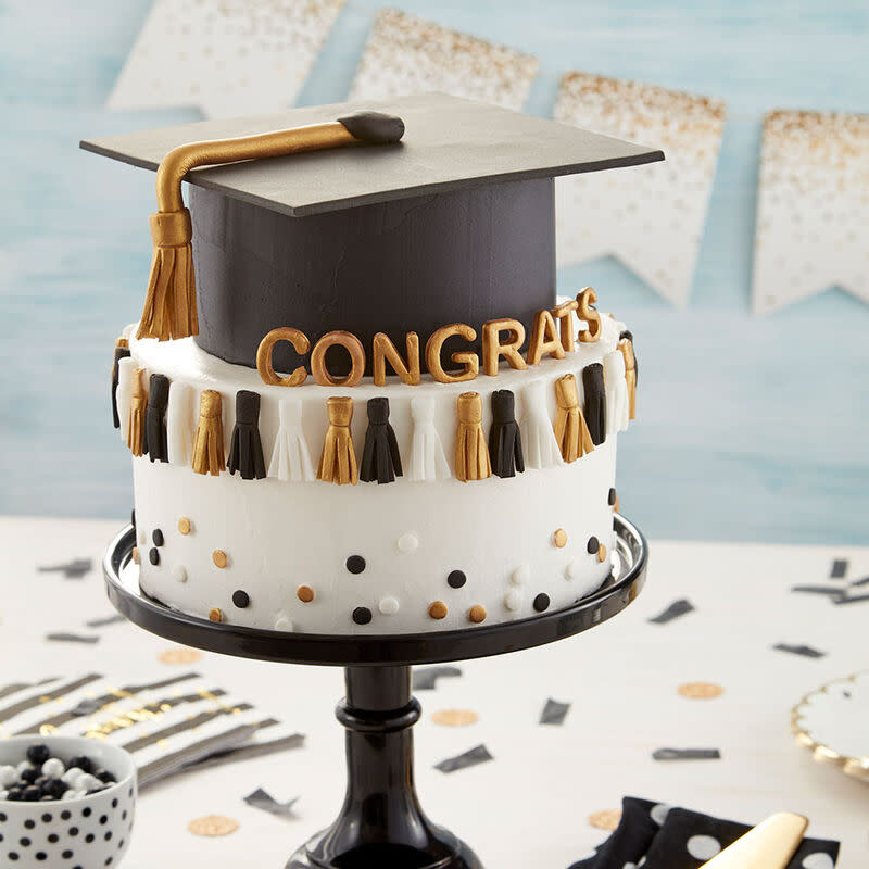 <p>Wilton</p><p>Decorated with little mini tassels and a gum paste graduation cap, this two-layer cake is great for parties and post-commencement get-togethers.</p><p><strong>Get the recipe: <a href="https://www.wilton.com/graduation-tassel-cake/WLPROJ-9244.html" rel="nofollow noopener" target="_blank" data-ylk="slk:Graduation Tassel Cake;elm:context_link;itc:0;sec:content-canvas" class="link ">Graduation Tassel Cake</a></strong></p>