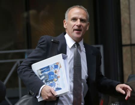 Tesco chief executive Dave Lewis leaves an office, after the announcement of the company's interim results, in the City of London October 23, 2014. REUTERS/Suzanne Plunkett