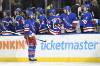 New York Rangers center Mika Zibanejad (93) is congratulated after scoring a goal during the third period of the team's NHL hockey game against the Detroit Red Wings, Friday, Jan. 31, 2020, in New York. This was Zibanejad's 200th point scored while with the Rangers. (AP Photo/Sarah Stier)
