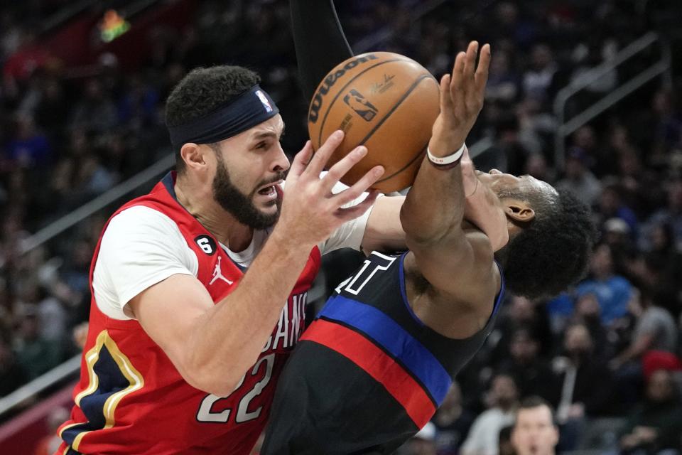 New Orleans Pelicans forward Larry Nance Jr. (22) charges into Detroit Pistons guard Hamidou Diallo (6) in the second half of an NBA basketball game in Detroit, Friday, Jan. 13, 2023.