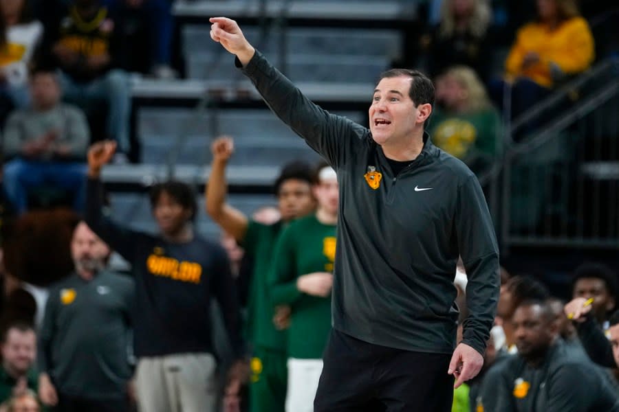 Baylor head coach Scott Drew talks to his team during the first half of an NCAA college basketball game against Texas, Monday, March 4, 2024, in Waco, Texas. (AP Photo/Julio Cortez)